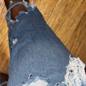Good American Ripped Mid Wash Skinny Jeans